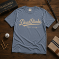 Sky blue crewneck graphic T-shirt with DeadStroke Golf Club script logo on front.